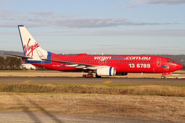 Boeing 737-800 (VH-VUC) - Virgin Blue B737-800 VH-VUC. Being towed to Bay 80, where it will spend the night