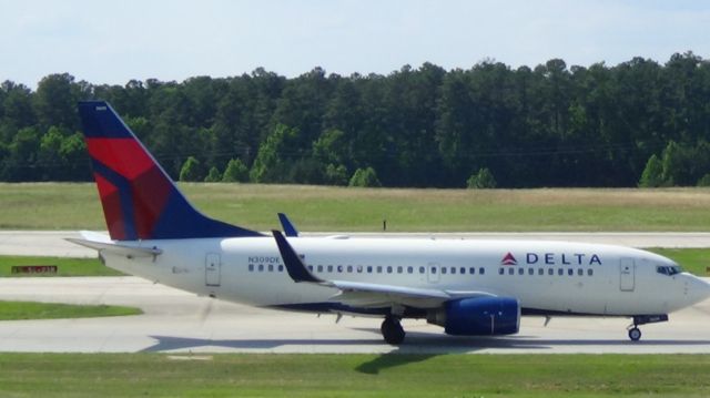 Boeing 737-700 (N309DE) - Delta 1077 DEPARTING from Atlanta at 4:16 P.M.  Taken June 7, 2015.