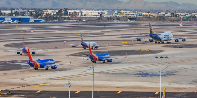 Boeing 747-400 (N481MC) - An Atlas Air 747-400 taxiing at PHX on 2/13/23, the busiest day in PHX history, during the Super Bowl rush. Taken with a Canon R7 and Canon EF 100-400 II L lens.