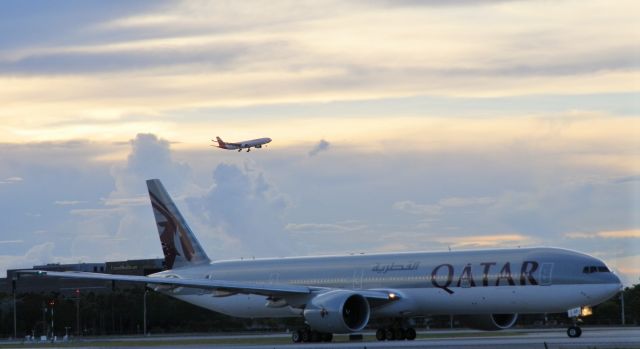 BOEING 777-300ER (A7-BEF) - Being flanked "By an Iberia A330-300"In the distance!