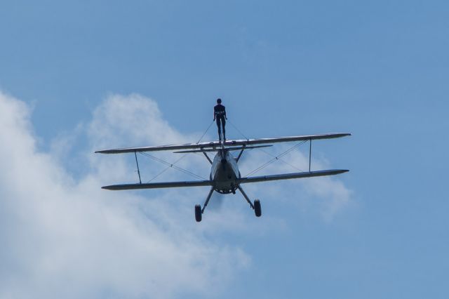 Beechcraft Baron (58) (N68853) - A wing walker enjoying the view as the aircraft turns around for the photo pass.