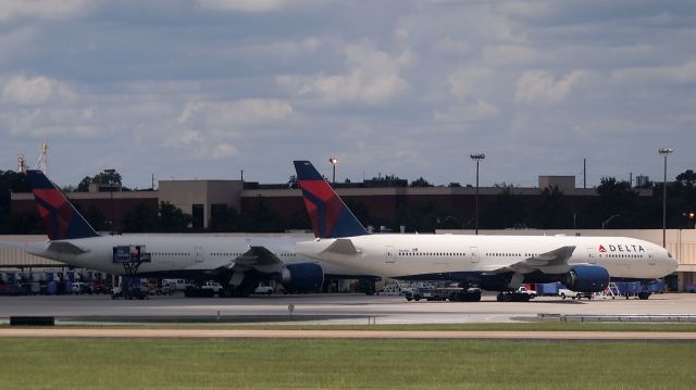 BOEING 777-200LR (N708DN) - Also N863DA (B772) in the background