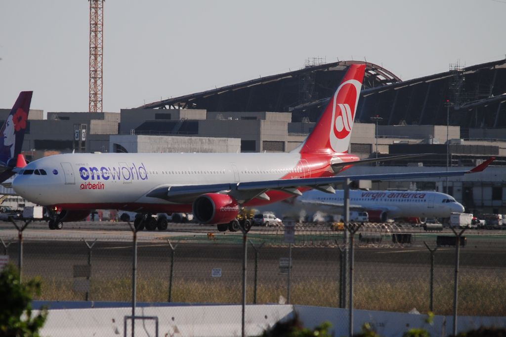 Airbus A330-200 (D-ABXA) - The ONEWORLD livery on Air Berlin's A332 is seen leaving 24L.