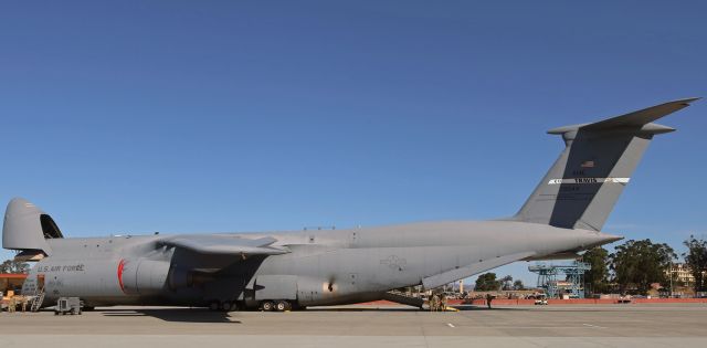 LOCKHEED C-5 Super Galaxy (87-0044) - Lockheed C-5M Super Galaxy (870044)br /br /I was pleasantly surprised to see that this is the same Super Galaxy I photographed at KNFL when it was doing T and Gs. When I spoke briefly with a crewperson, I described how I had been on the edge of Runway 31L at Fallon when, during its s/final to the outboard runway 31R, this Super G had unexpectedly realigned on to NFL's inboard 31L and as a result had passed me so closely I couldn't get anything other than two tires in my pic. He told me that since I had (almost) been on board, I had earned a memento.br /When I got back home, I sewed it on to my camera bag. TYVVM, Sir.