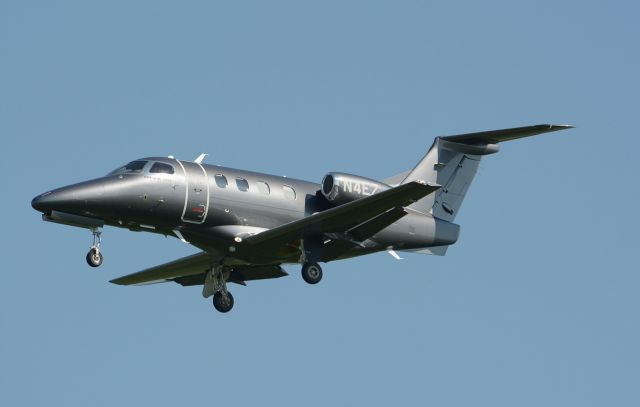 Embraer Phenom 100 (N4EZ) - On final to 24R in CYHU.