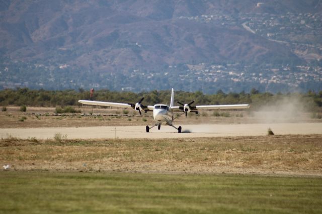 De Havilland Canada Twin Otter (N926MA) - Touching down on the dirt strip after a load of skydivers