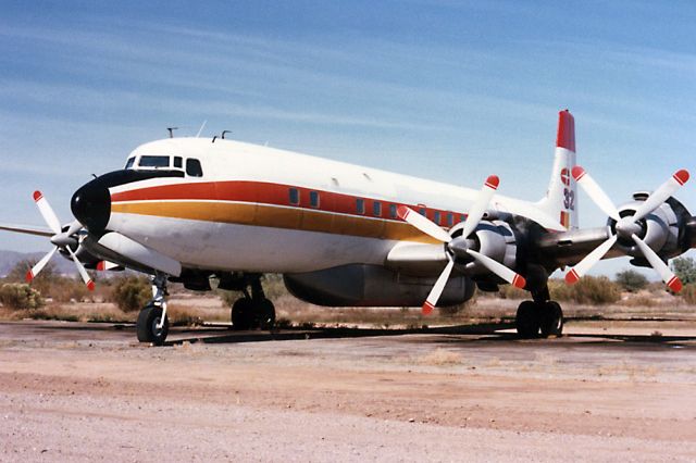 Douglas DC-7 (N9734Z) - Nov. 1987 - Pristine DC-7 at its home base, Chandler Memorial Airport, AZ