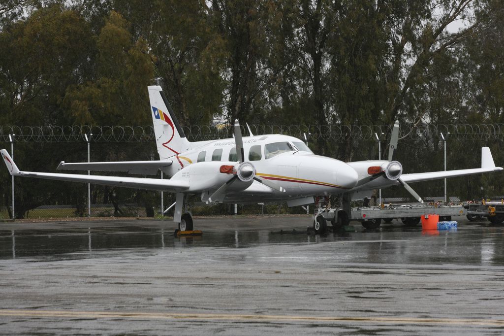 Piper Navajo (VH-UAA) - Aviation Australia Pressurised Navajo sitting in the rain at the 2014 careers expo