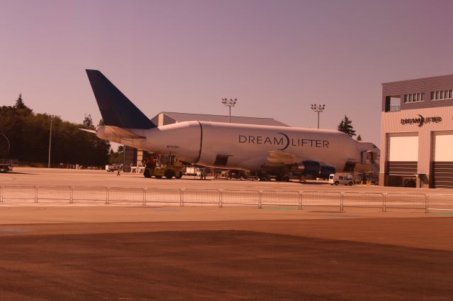 — — - Boeing Dreamlifter unloading at Paine Field, Thurs 9/11/14. I had to take the photo through a tinted window. Sorry about the color.