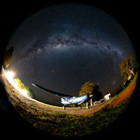 Cessna Caravan (VH-NMV) - Circular fisheye photo of NMV under the night sky.