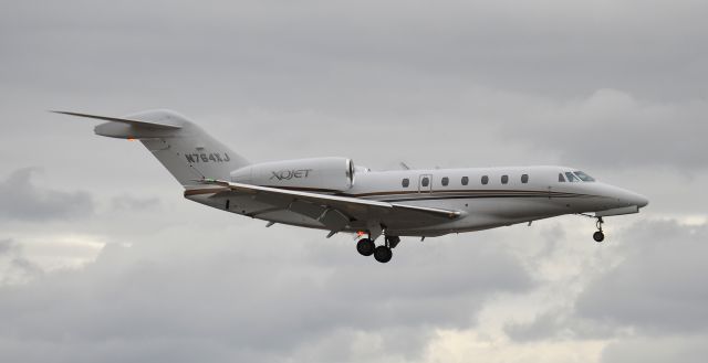 Cessna Citation X (N764XJ) - Arriving on runway 20R on an overcast day