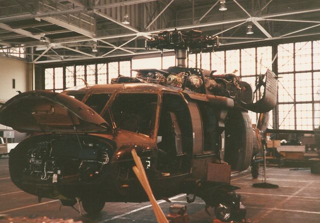 N23557 — - This Blackhawk is completely taken apart for 500 hr. inspection. At NAS Jacksonville Fl. hanging off the lower left wing is the Night Sun search light.