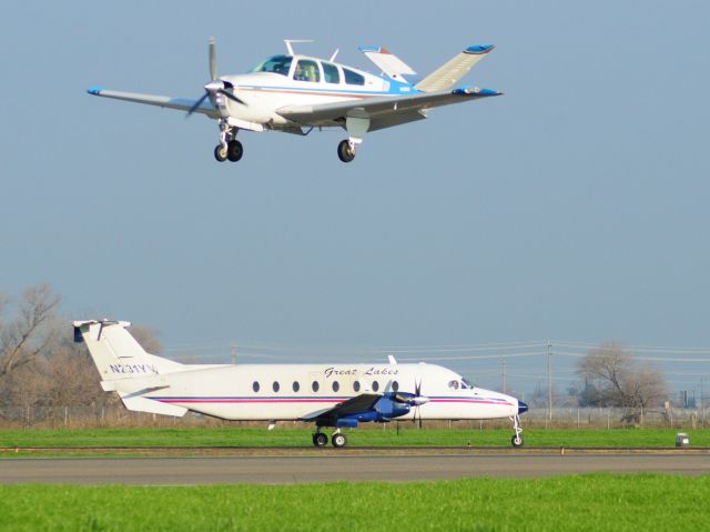 Beechcraft 1900 (N231YV) - Great Lakes flight GLA197   holding short runway three-zero for landing Beechcraft. Merced Regional Airport.