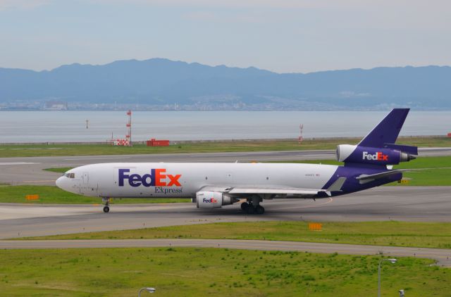 Boeing MD-11 (N584FE) - Airline: FedEx Express (FX/FDX); Airport: Kansai International Airport (KIX/RJBB); Camera: Nikon D7000; Date: 4 July 2012