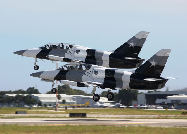 Aero L-39 Albatros (N137EM) - A pair of former Black Diamond Jet Team L-39 Albatrosses departing from the Fort Lauderdale Executive Airport, October 2012