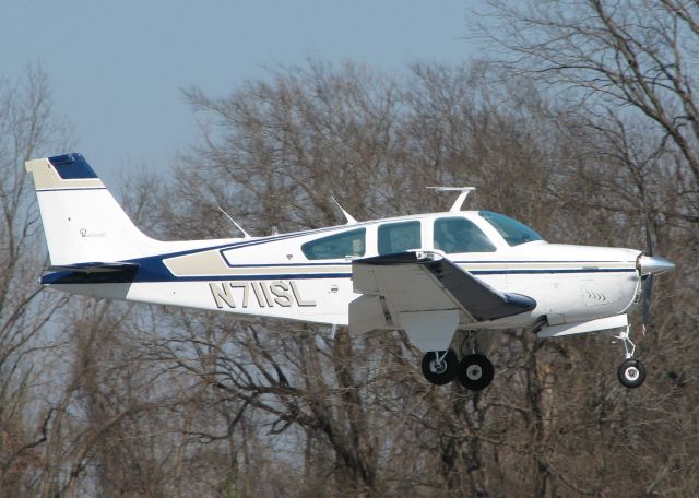 Beechcraft Bonanza (33) (N711SL) - About to touch down on runway 14 at Downtown Shreveport.