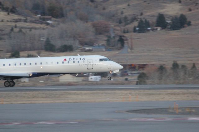 Canadair Regional Jet CRJ-700 (N713EV) - N713EV taking off runway 12 at Butte as SKYWEST 4312 to KSLC.br /br /Taken 18:09, November 2, 2024 with a Canon EOS T2i and 70-300mm (300mm, 1/250, ƒ5.6, ISO 3200)