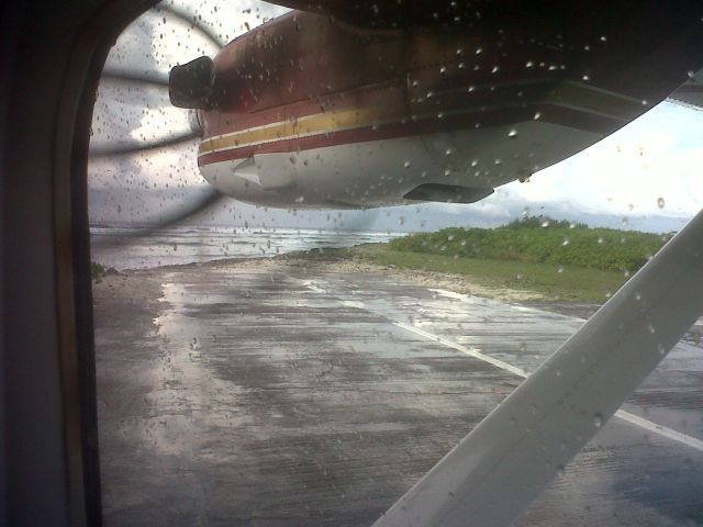 HARBIN Y-12 — - Back on the Y12 aircraft owned by IDC.  Small landing strip with seas on both sides makes for a tight turn and hard braking after ones land on what is a short landing strip.  Weather here was blustery with some rain.