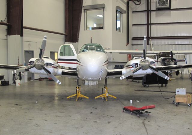 Beechcraft Baron (58) (N8111M) - First class maintenance shop at RELIANT AIR. They have also the lowest fuel prices on the Danbury (KDXR) airport.