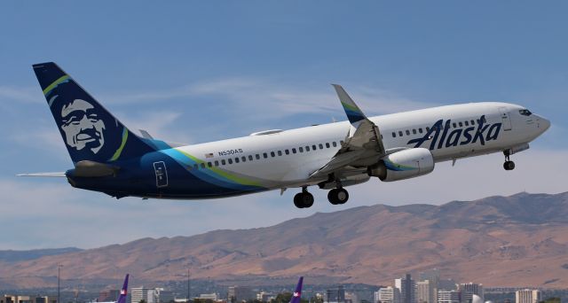 Boeing 737-800 (N530AS) - Although runway 17L was the designated arrival-departure runway, ASA's N530AS is captured here as the first of three "wrong way" departures from the other end of 17L ... runway 35R.br /br /Departing toward the direction of oncoming aircraft making landing approaches is (to put it lightly) frowned upon. However, the circumstances that existed at this time necessitated the decision to have aircraft arriving at RNO use the designated runway (17L-35R) while aircraft departing use the opposite end (35R-17L) and take off toward the approach path of arriving planes.br /The ATC personnel in the RNO tower handled the situation quite proficiently. Departures such as this Alaska Boeing and a United and Delta aircraft were queued at the 35R end of 17L and landing aircraft were given priority. Then, when the approach route to 17L was clear and airspace north of RNO was empty, the aircraft in the queue at 35R were cleared to take off. It was all very "routinely' handled, despite the increased stress caused by the heavy smoke and ash being blown into the southern end of the airport by the high winds from the southwest that were whipping up the Davis wildfire just a few miles SW of the airport. And added to the danger of the thick smoke and ash at low altitude level was the presence of 15 firefighting aircraft (jets, props, and helicopters) operating in the airspace just south of runway 17L-35R.
