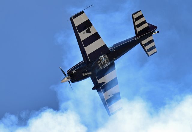 EXTRA EA-300 (N46EX) - Vicky Benzing falling back into her own smoke trail after flying straight up during her performance at the 2015 Hollister Airshow.