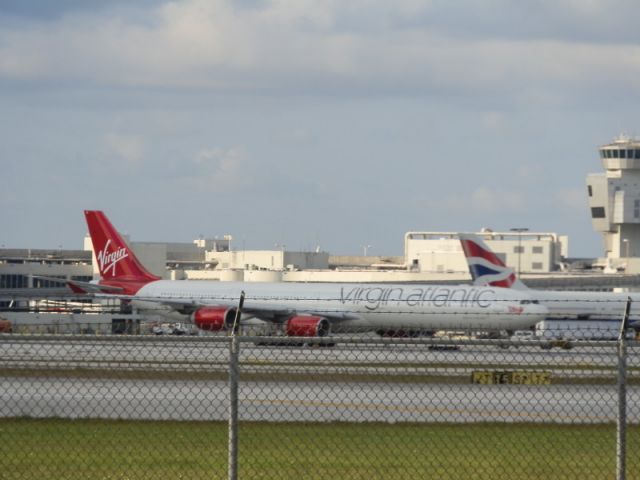 Airbus A340-600 (G-VEIL) - Departing gate.