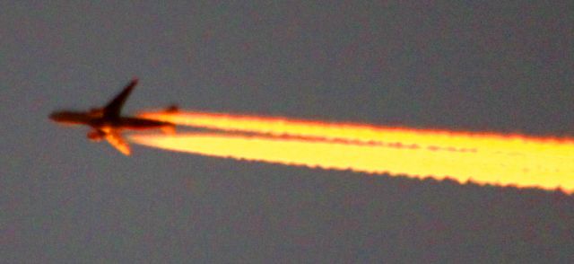 — — - Headed toward KLAX over KSJC, Estimated at about 35,000 feet,  The plane was actually flying along safely, though it does not appear as such .. The contrail and aircraft picked up the reflection of a winter California sunset .. 12/07/2012