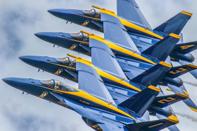 McDonnell Douglas FA-18 Hornet — - This photo is from the VERY FIRST performance where the Blue Angels debuted the FA18 SUPER HORNET as their new aircraft. I personally really love this photo and I hope everyone else does as well. The symmetry is about as perfect as possible. You can clearly see the Commander in the number 1 aircraft looking ahead and the other three pilots are concentrating on the aircraft to their left.The show was at the Sun N Fun aerospace expo in Lakeland Florida April 2021. I used 600mm of Canon lens and the camera settings were 1/8000 F5.6 ISO 800. Please check out my other photography. Positive votes and comments are always appreciated. Questions about this photo can be sent to Info@FlewShots.com