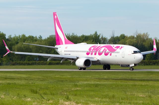 Boeing 737-800 (C-GDMP) - Turning around on the runway to backtrack to the exit