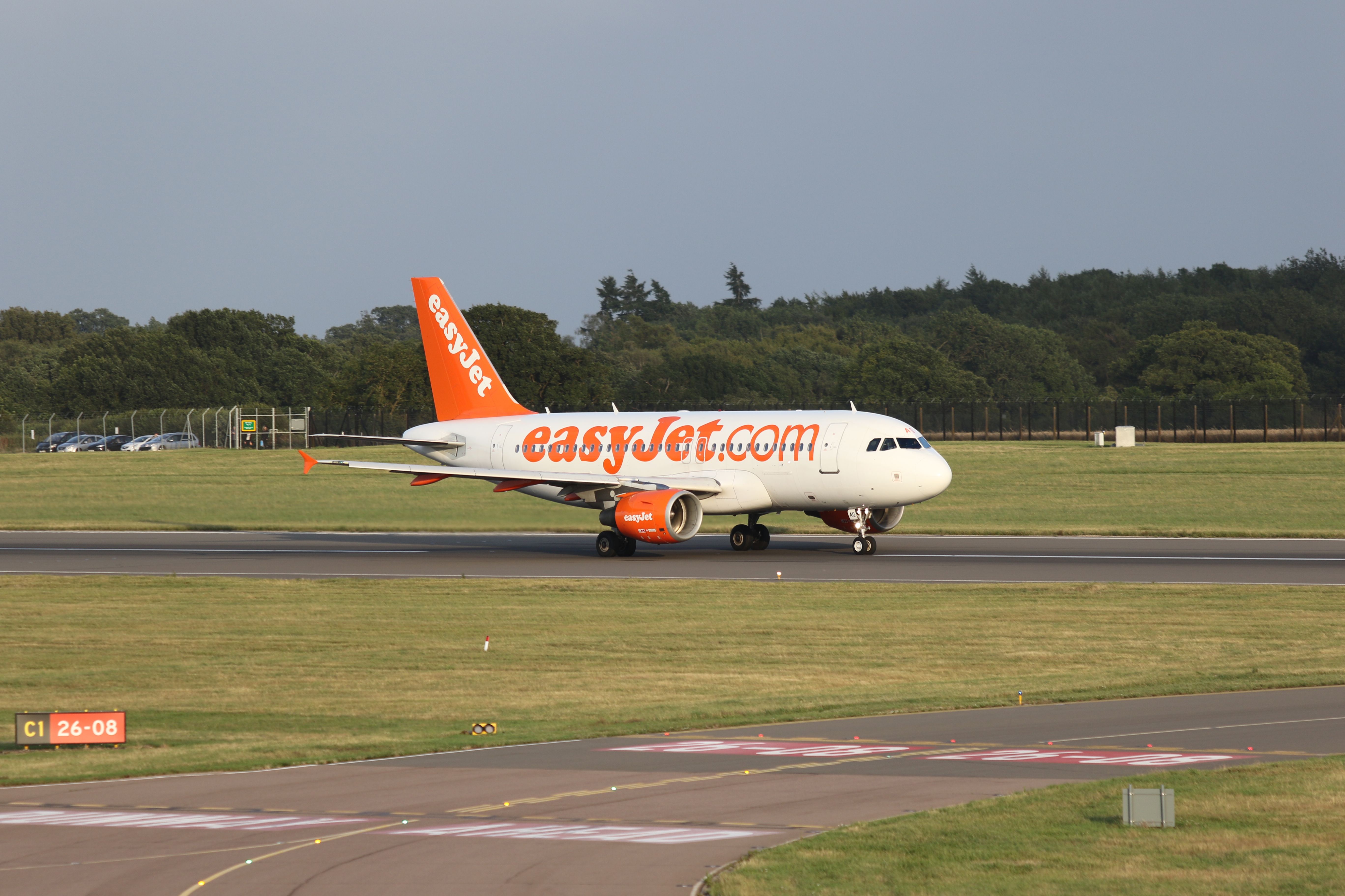 Airbus A319 (G-EZAG) - Early evening departure, photographed from top of multi-storey car park 