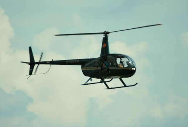 Robinson R-44 (N395TD) - PEE DEE HELICOPTERS LLC landing on the Wilson Air FBO ramp at KCLT - 8/16/14