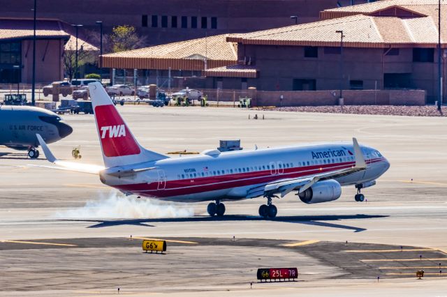 Boeing 737-800 (N915NN) - An American Airlines 737-800 in TWA retro livery landing at PHX on 2/28/23. Taken with a Canon R7 and Canon EF 100-400 L ii lens.