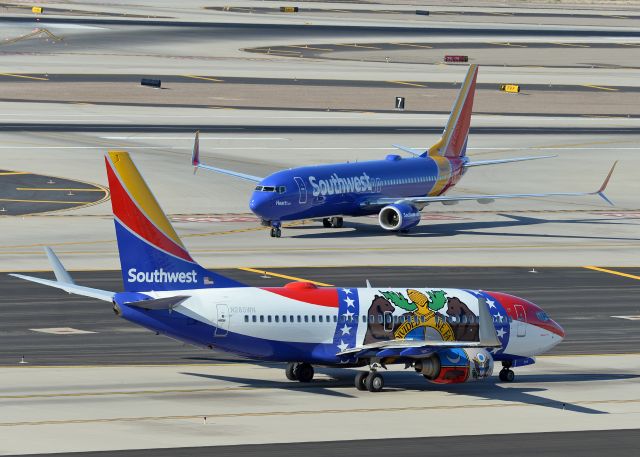 Boeing 737-700 (N280WN) - Missouri One is taxing out while Heart Two (N8645A) is taxing to the gates. 