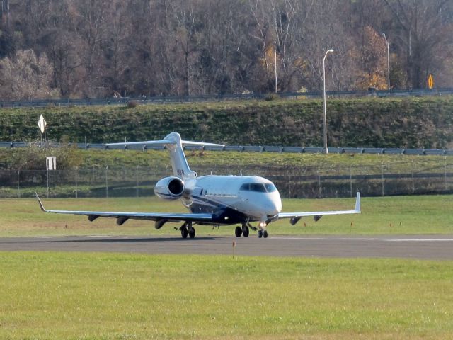 — — - Flexjet taking off runway 26 at Danbury CT.