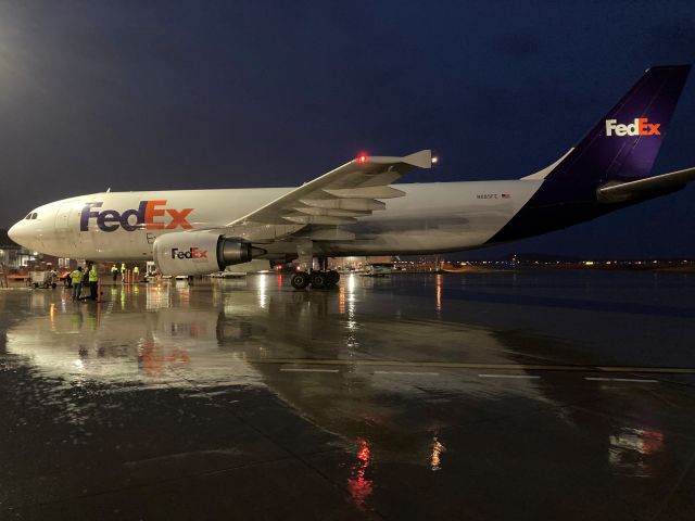 Airbus A300F4-600 (N685FE) - A306 "Kaylyn" has just arrived from Fargo, ND on a warm, wet March evening.  Flight 325 will have empty freight containers unloaded from the top deck. And minutes later full ones loaded on the top and bottom flight decks during the "turn around" for Flight 325. 