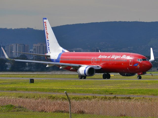 Boeing 737-800 (VH-VOX) - On taxi-way heading for take off on runway 05. Thursday 12th July 2012.