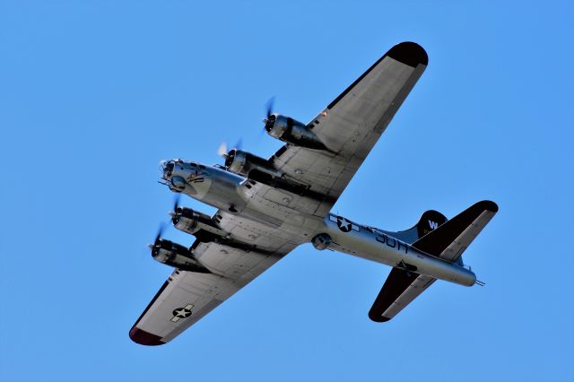 Boeing B-17 Flying Fortress (N5017N) - One of the many flights for Aluminum Overcast out of Appleton during Oshkosh 2017.....backlit with the sun.