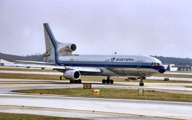 Lockheed L-1011 TriStar — - L1011 Eastern Airlines taxis at Atlanta in 1986. I was taking pictures from the parking garage on the south side of the airport. Scanned from one of my prints.