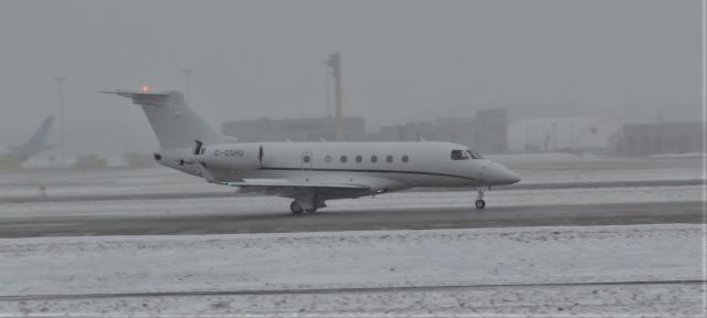 Embraer Legacy 550 (C-GSHU) - Taken during a snow storm in CYUL