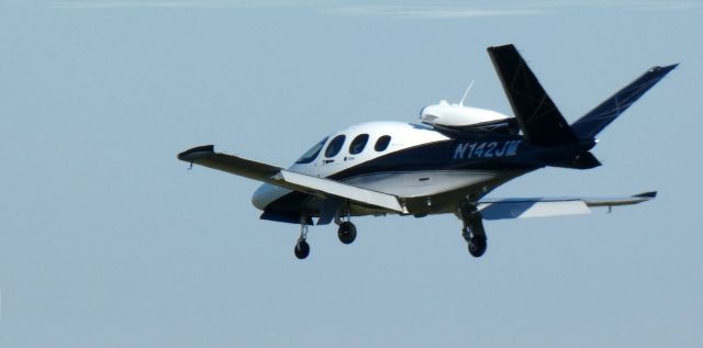 Cirrus Vision SF50 (N142JM) - On short final is this brand new Cirrus Vision Jet SF50 in the Autumn of 2022.