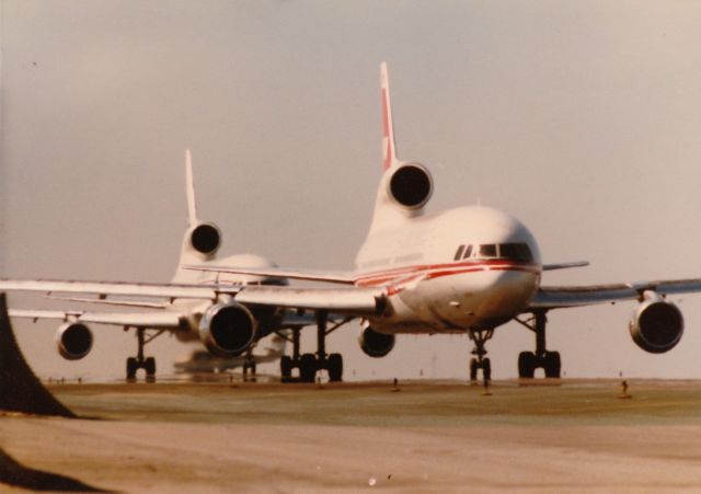 Lockheed L-1011 TriStar — - TWA Tristar in line for take off at KLAX  with a Delta Tristar in line behind it