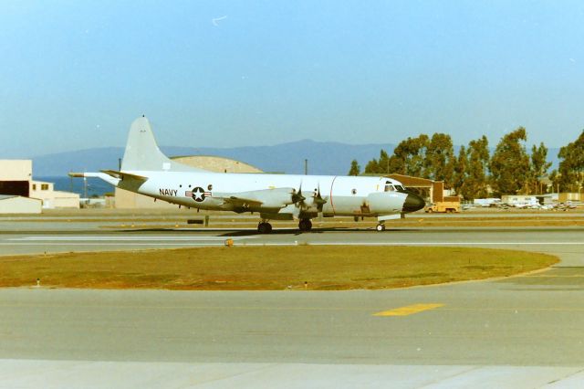 Lockheed P-3 Orion — - KMRY - Spyplane ?? There are no identifying numbers on the P-3 only the Navy insignia as this "Orion" departs Monterey - even under the horizontal stabilizers, I zoom shot that area as it rolled by looking for numbers and nothing...apprx date June 1988.