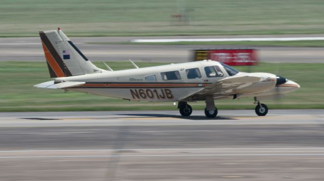 Piper Seneca (N601JB) - A Piper Seneca sporting the US and Alaskan flags taxis for takeoff at Ellington Field on March 18, 2021