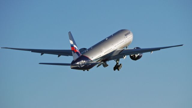 BOEING 777-300 (VQ-BQB) - BOE335 makes a missed approach to Rwy 16R during a flight test on 1/26/14. (LN:1167 cn 41687).