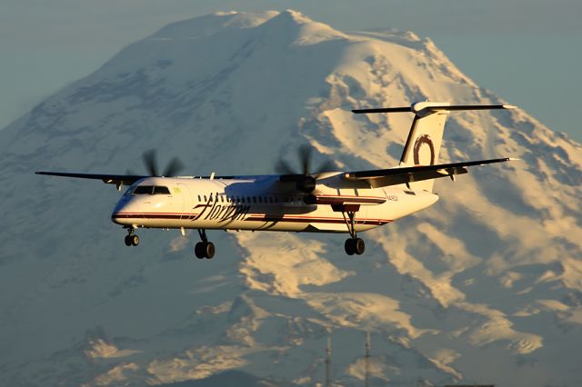 de Havilland Dash 8-400 (N418QX) - The Wings of the Northwest posing with the trademark of the Northwest Mt. Rainier.