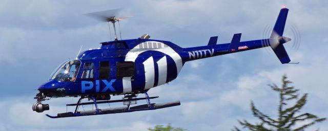 Bell JetRanger (N11TV) - LINDEN AIRPORT-LINDEN, NEW JERSEY, USA-SEPTEMBER 03, 2021: A news helicopter from one of the local New York City T.V. stations is pictured shortly after taking off.