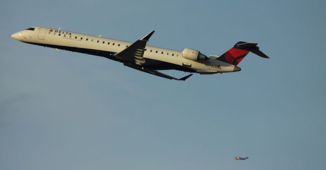 Canadair Regional Jet CRJ-900 (N693CA) - Departure from 30L, to KSEA. 05-13-2015  N558SW lower right (Southwest) 