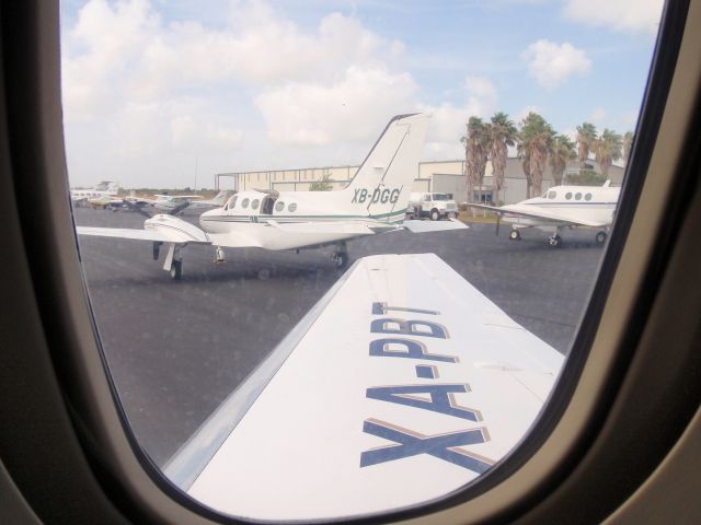 Cessna 421 (XB-DGG) - Taken from Hawker 800XP XA-PBT taxiing from Southmost Aviation at KBRO