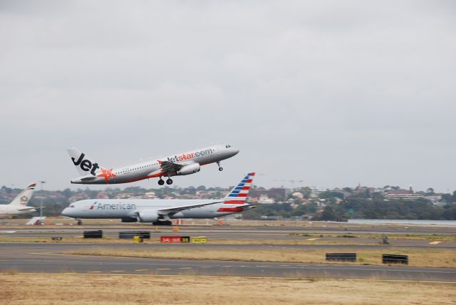 Airbus A320 (VH-VGO) - i saw this jetstar rotate just at the right moment that it makes it look like it is directly on top of the dream liner 