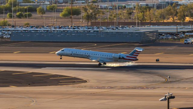 Canadair Regional Jet CRJ-700 (N705SK) - American Airlines CRJ-700 landing at PHX on 7/7/22. Taken with a Canon 850D and Rokinon 135mm f/2 lens.